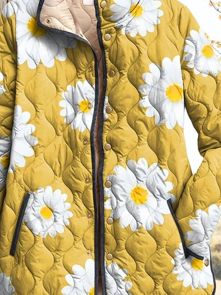Florence quilted jacket close-up showing daisy print, stud placket and bound pocket