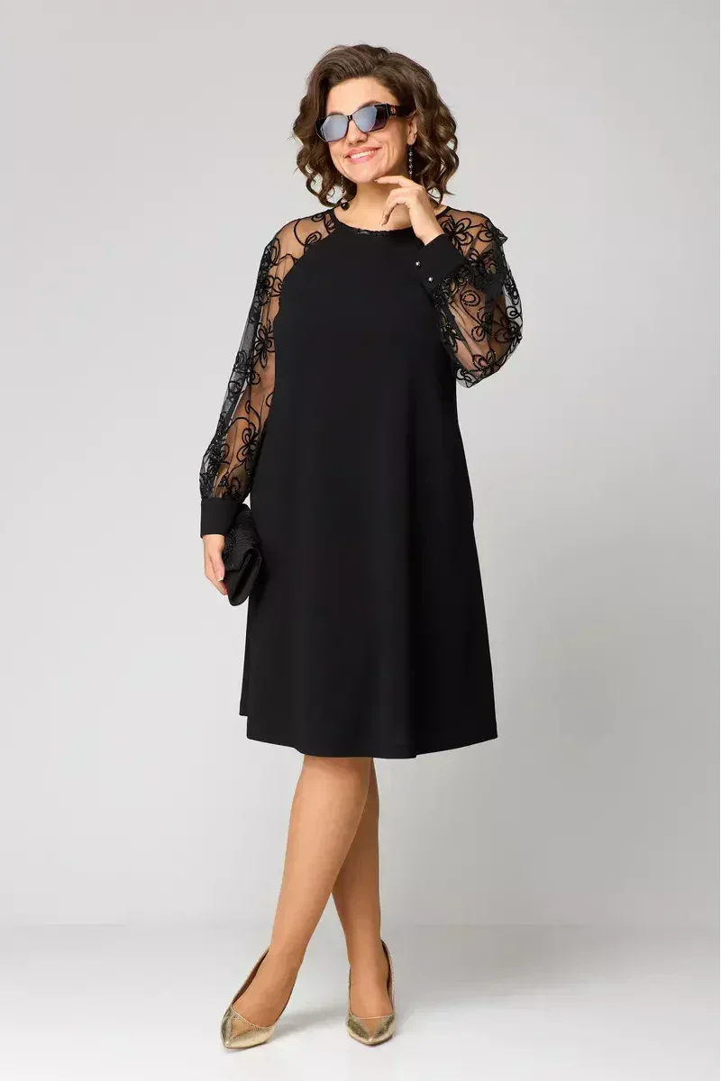 Nicole elegant dress in black, full-length view of the flared knee-length skirt