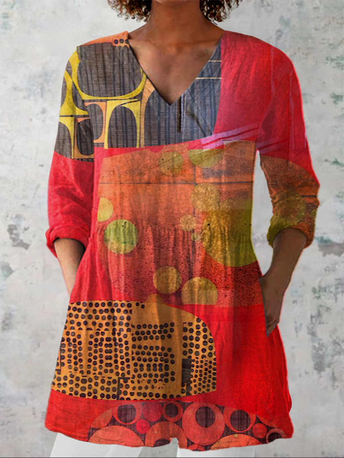 Lucie long V-neck blouse in red abstract print, front view on model