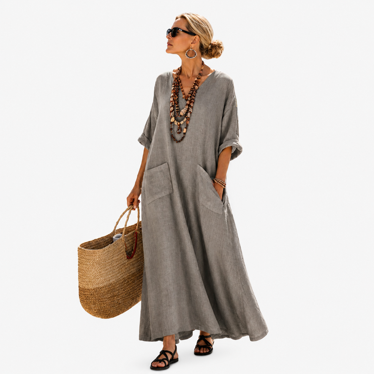 Long kaftan in stone grey with V-neckline and patch pockets, full-length front view