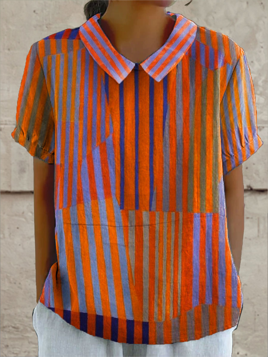 Nina geometric striped blouse in orange, purple and blue, front view on model