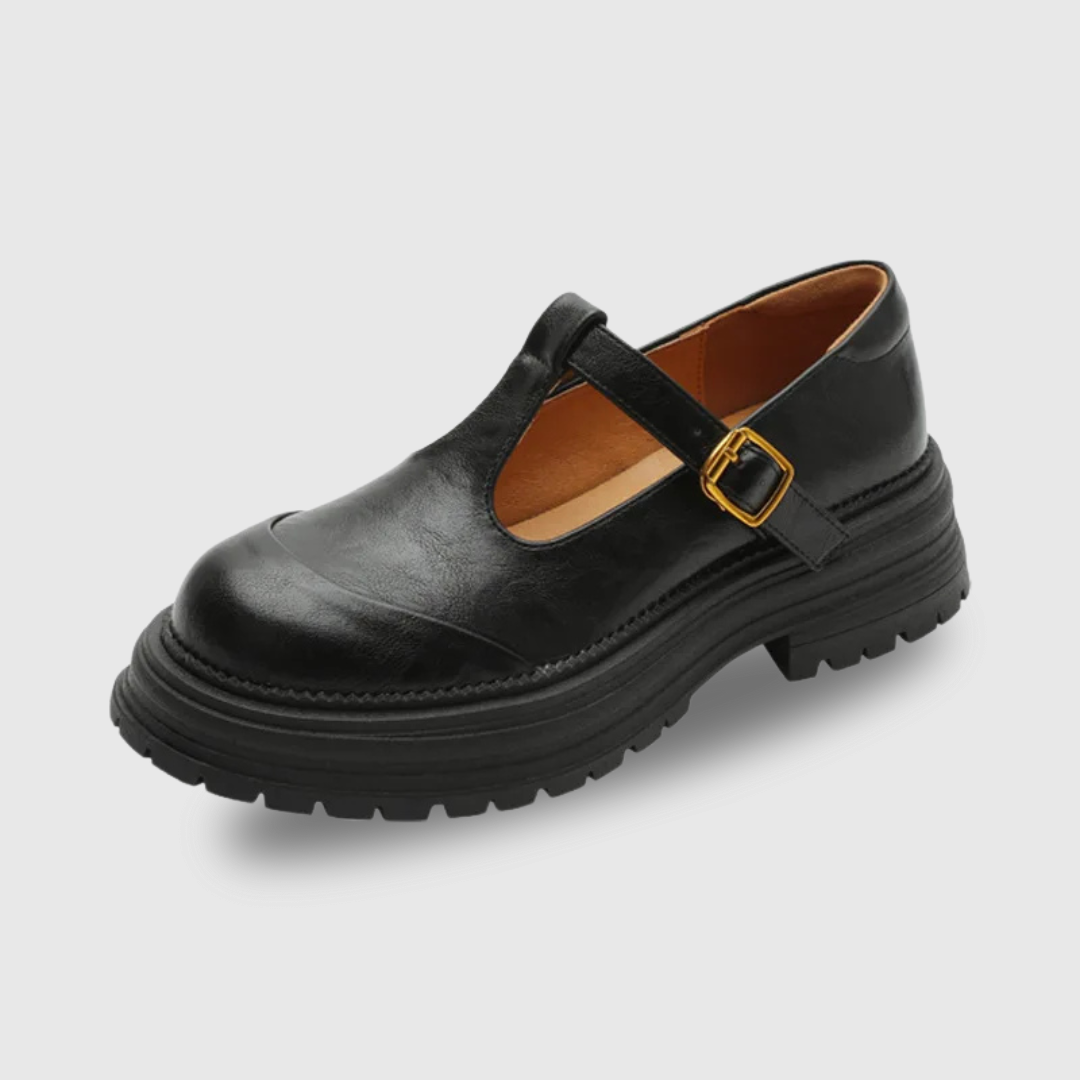 Luna classic T-bar shoe in black, side view on plain background