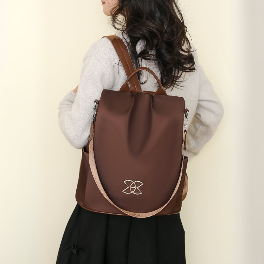 BeBold backpack in brown, rear view showing top handle
