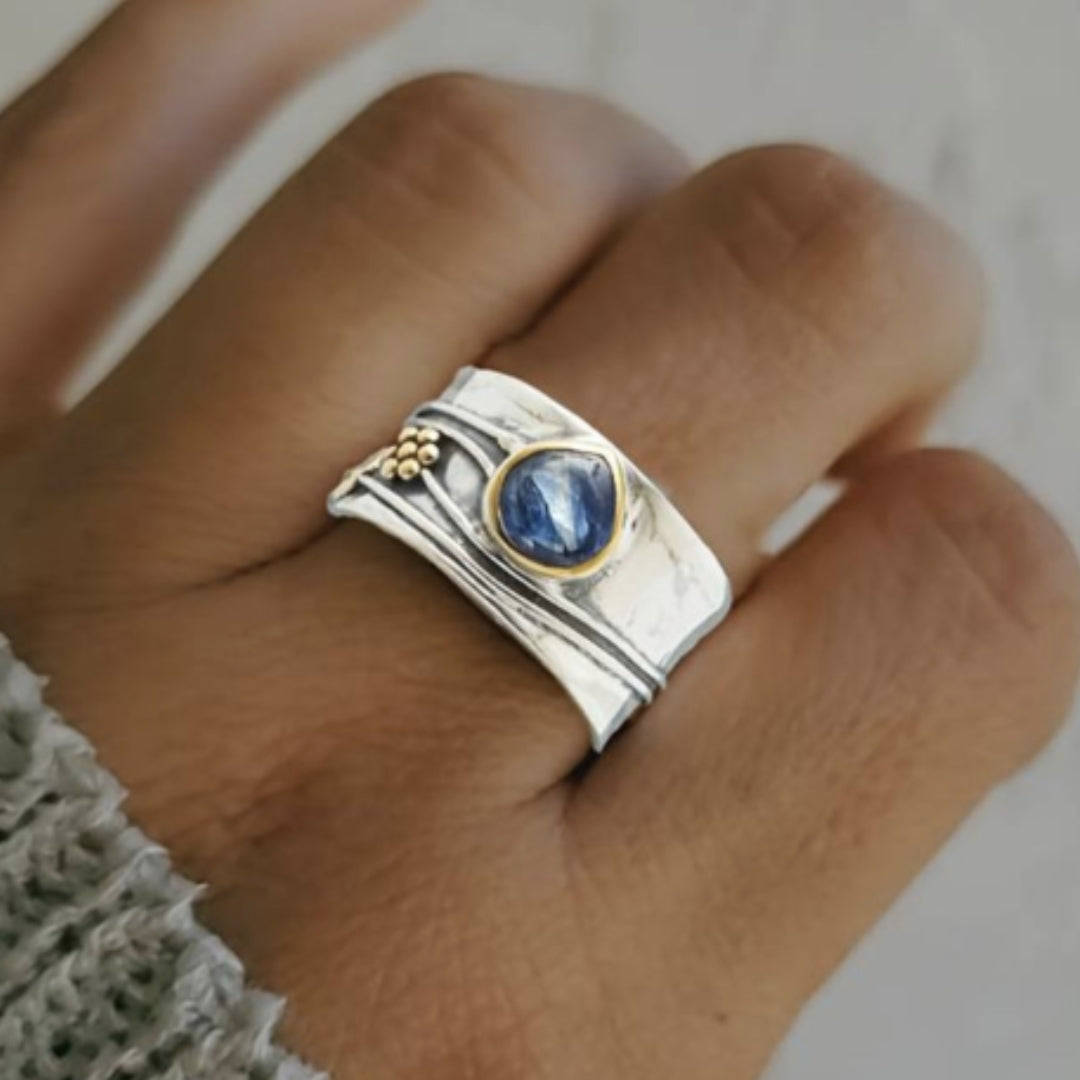 Bohemian meditation ring worn on the hand, blue stone and gold beads