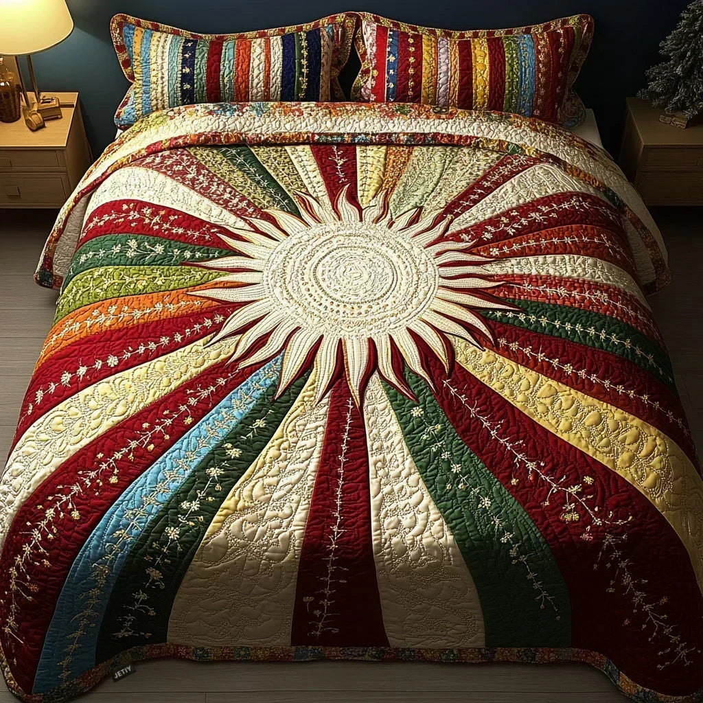 Sun Glow quilted bedding set with sunburst pattern and two matching pillowcases on a bed