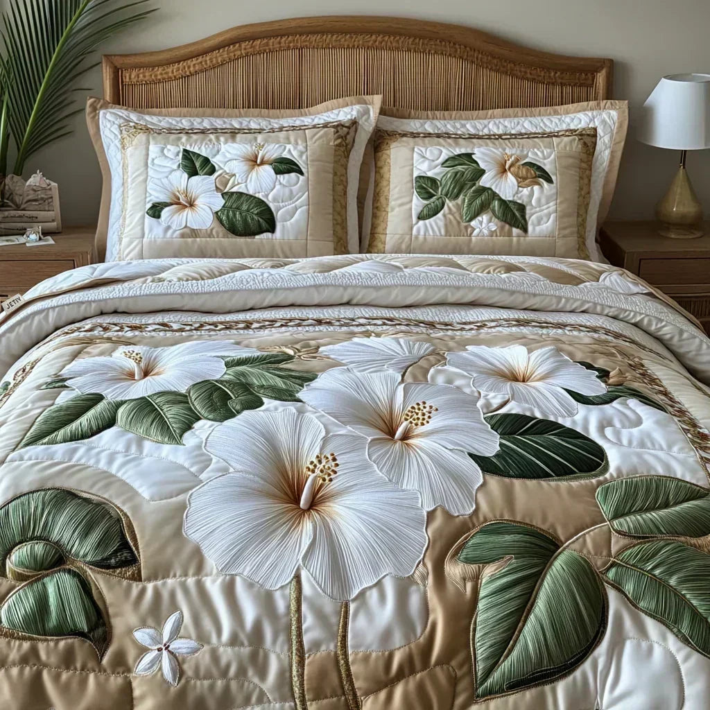 Three-piece quilted bedding set in cream with white hibiscus print, styled on a double bed