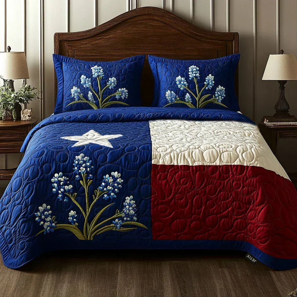 Texas Pride quilted bedding set on a bed with lone star, bluebonnets and matching pillowcases