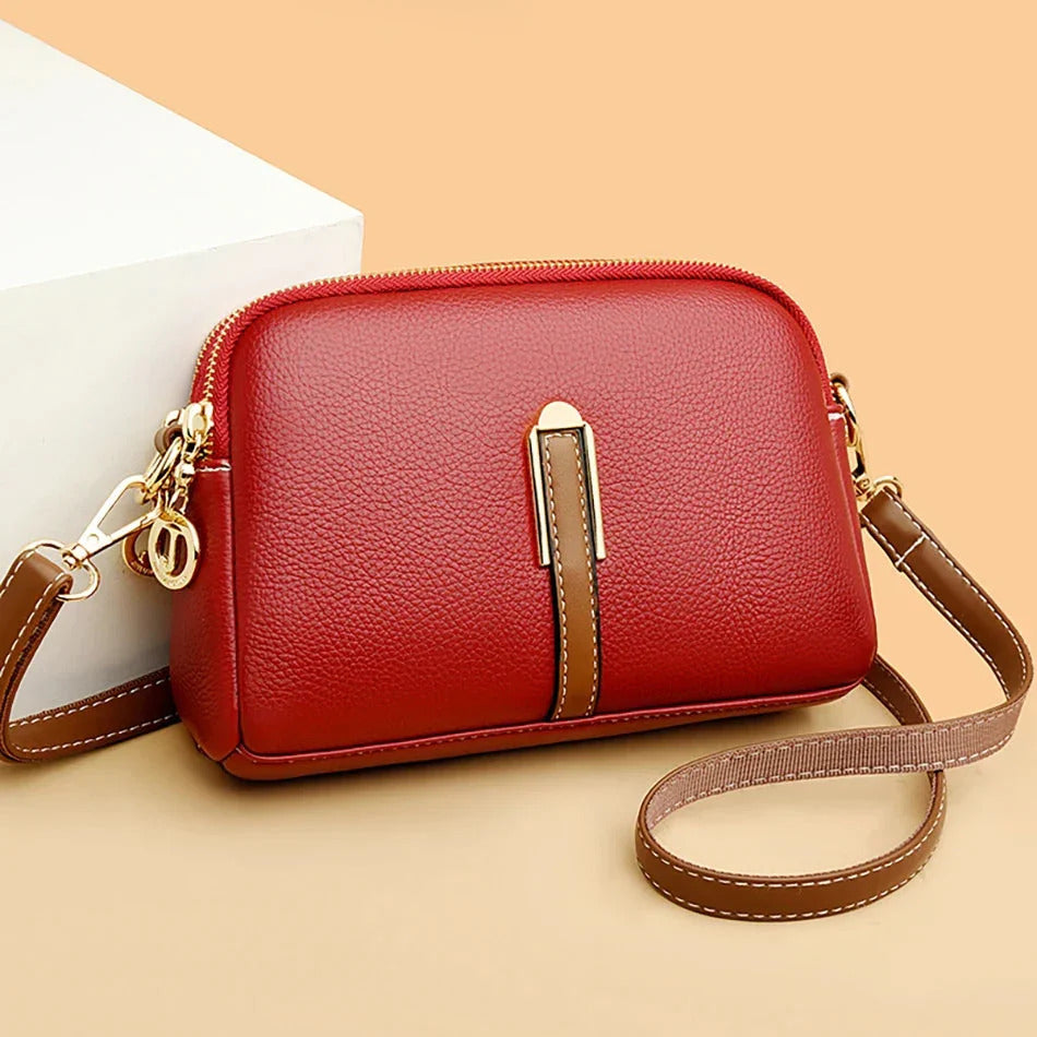 Emanuela crossbody bag in red with tan strap, front view