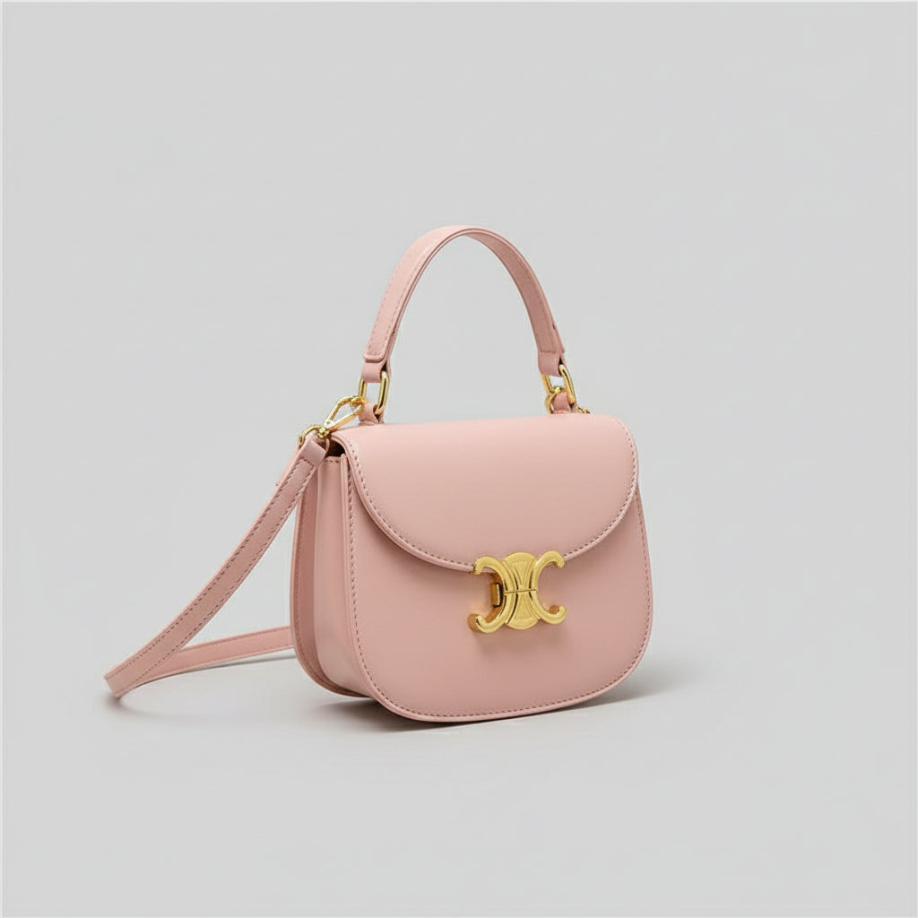 Mini crossbody bag in pink with gold-tone clasp, three-quarter side view