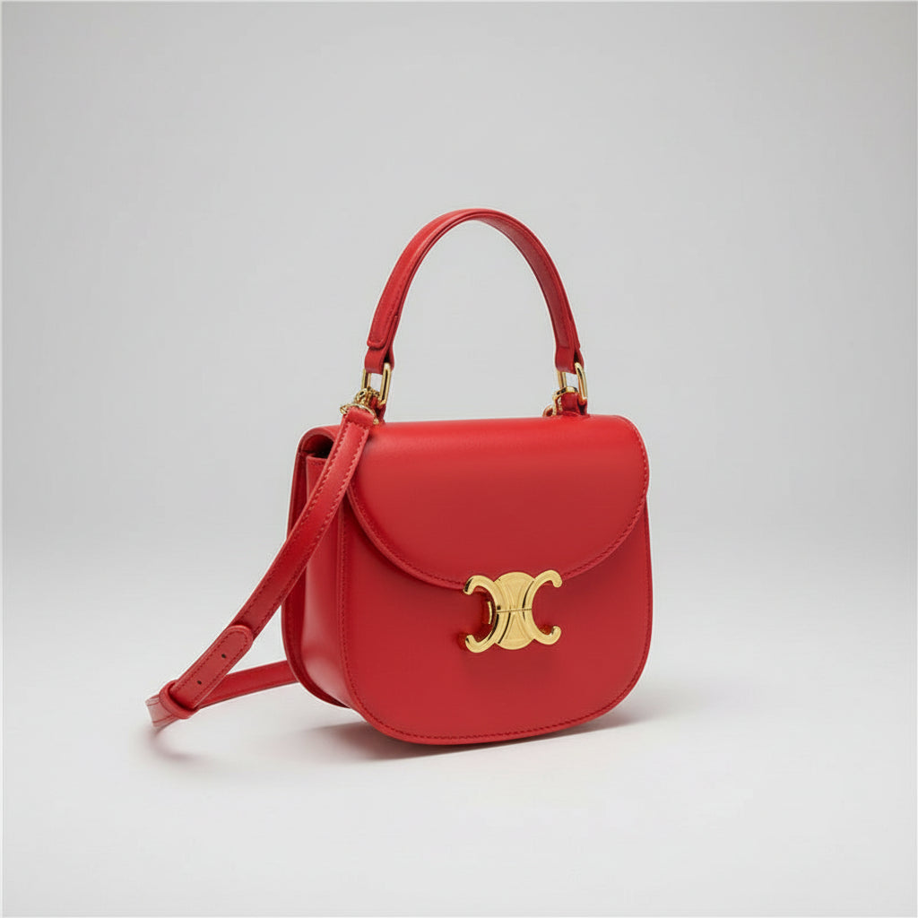 Mini crossbody bag in red with top handle, three-quarter side view