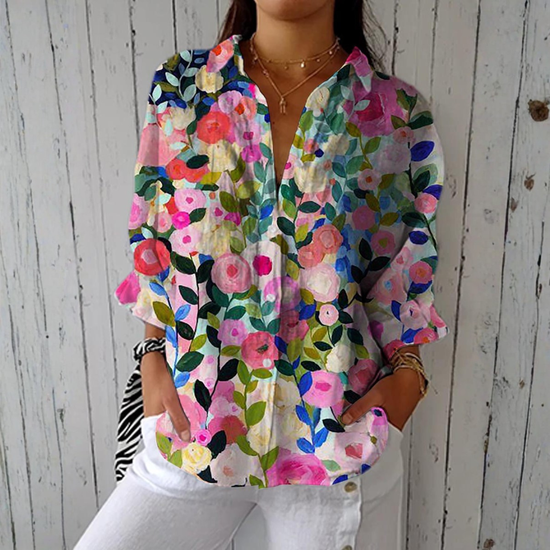 Sylvia hand-painted floral blouse in multicolour, front view worn with white trousers