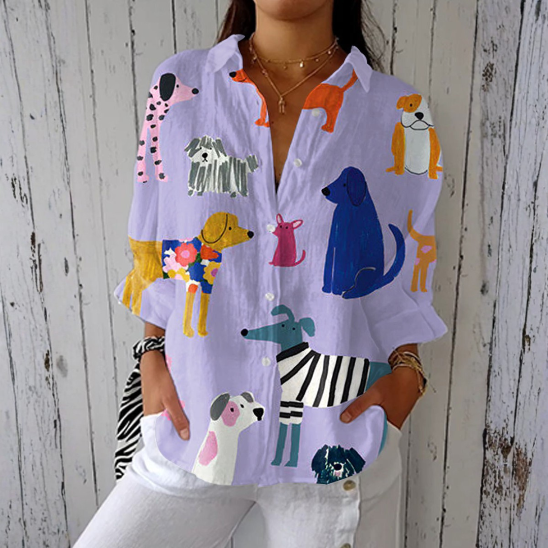 Helena playful dog print blouse in lavender multicolour, front view worn with white trousers