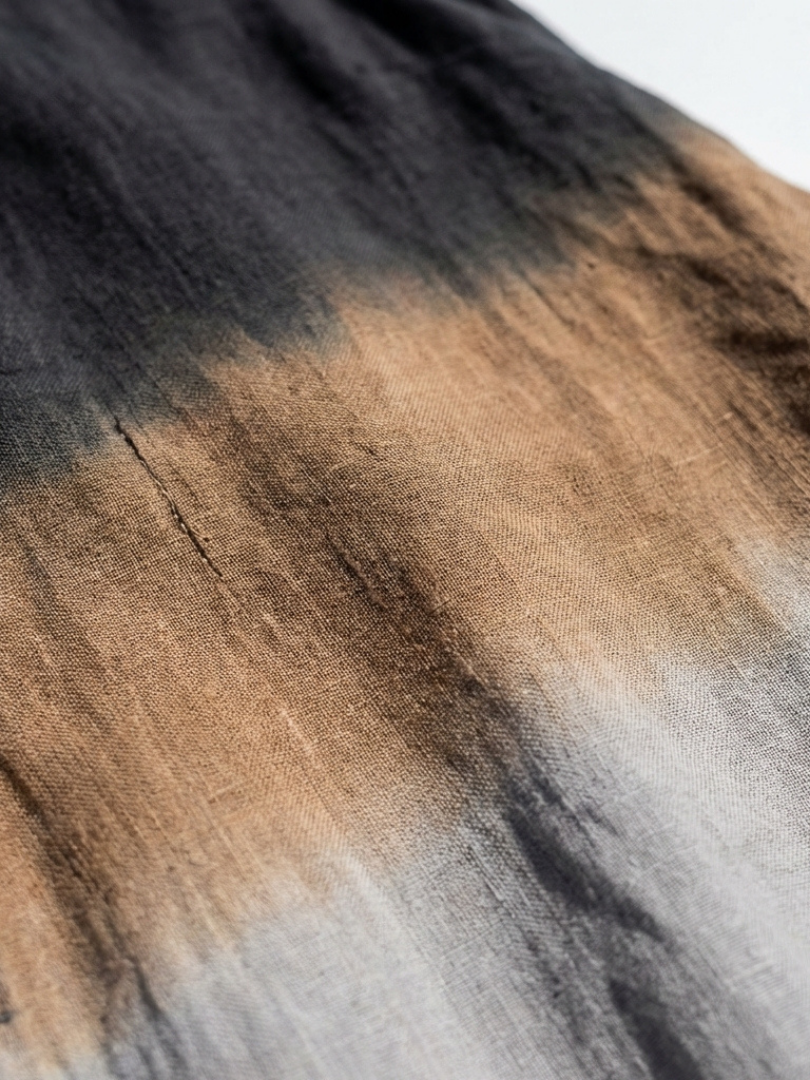 Close-up of Sorelle dress fabric showing ombre dip-dye and woven texture