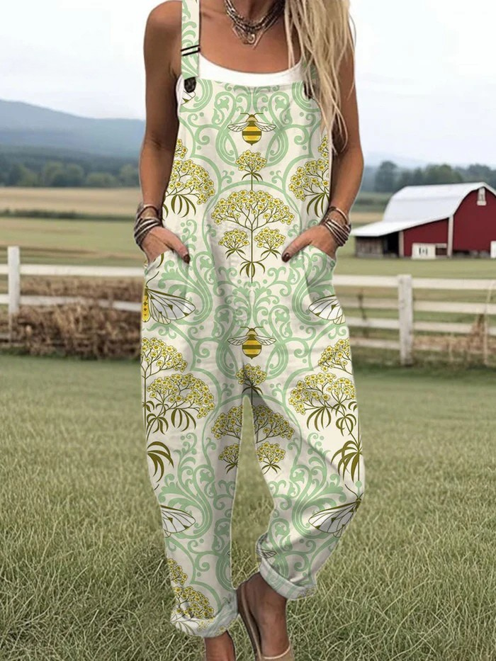 Honeybee Bloom dungarees in cream with green and yellow bee print, full-length front view