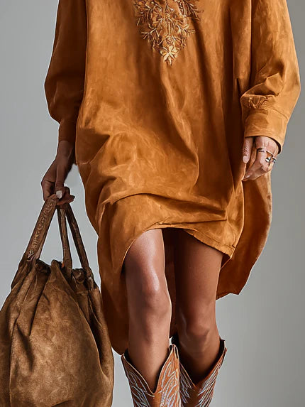 Sybil brown midi dress, close-up of hem and buttoned cuff detail