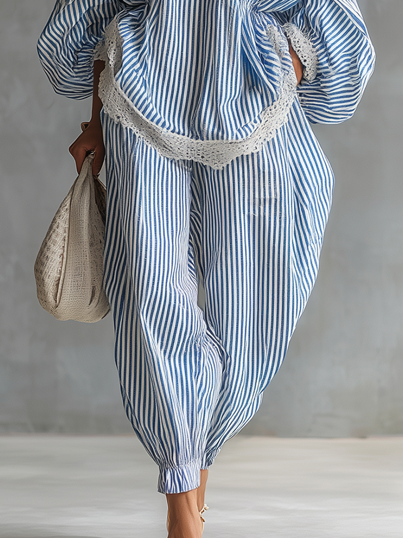 Sofia striped trousers in blue, close-up of cuffed ankles