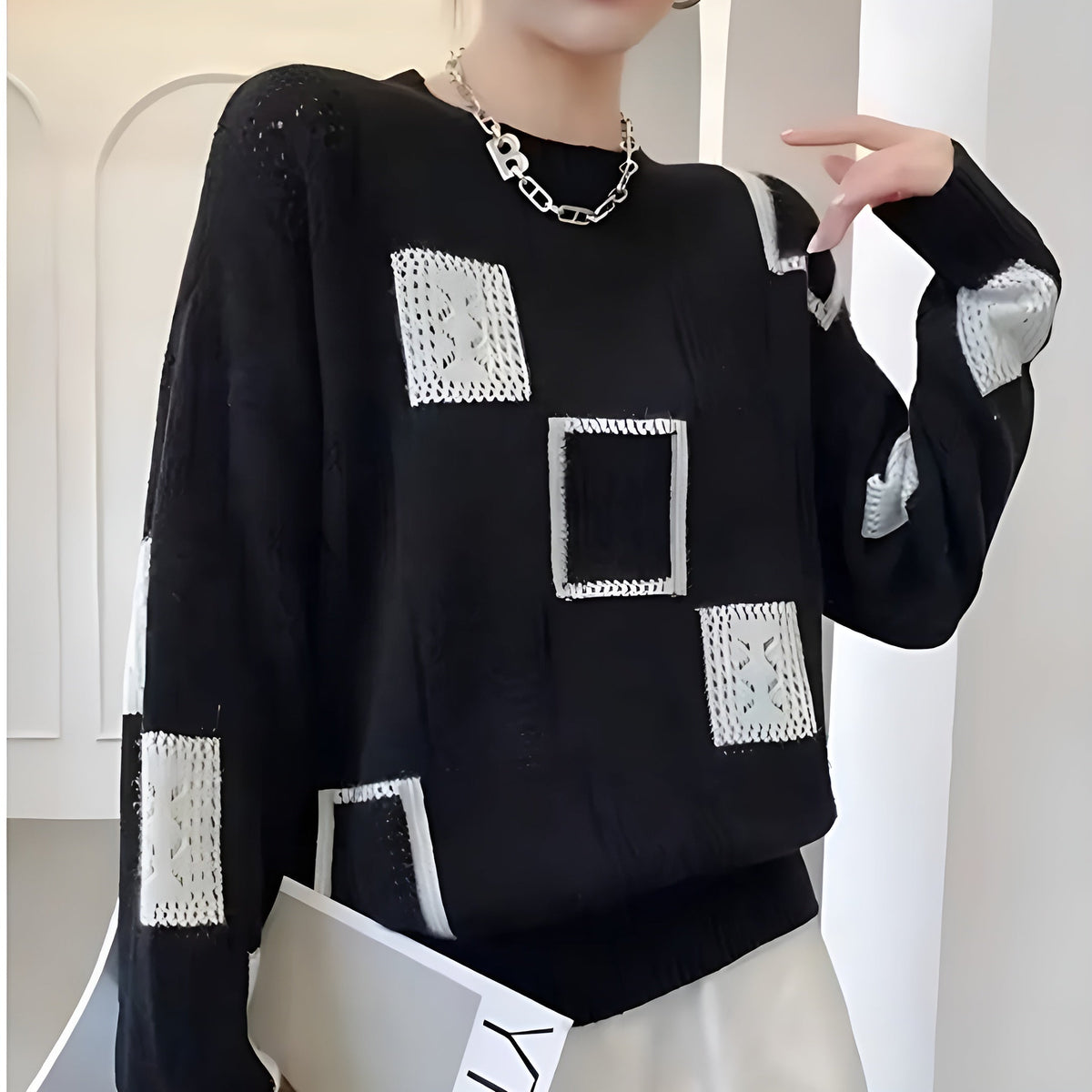 Zaydeanne black sweater close-up of openwork square knit detail