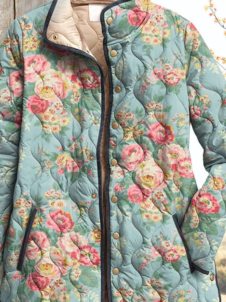 Dorothea quilted jacket close-up showing press studs, piping and welt pockets
