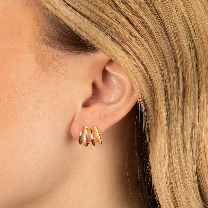 Zabby gold spiral ear cuff with zircon stones worn on the ear