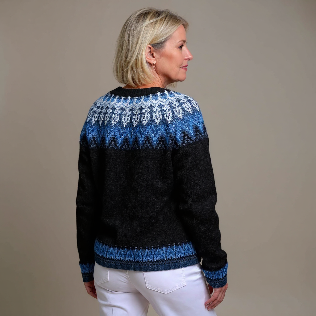 Gianna knitted cardigan in black and blue, back view showing Nordic yoke pattern