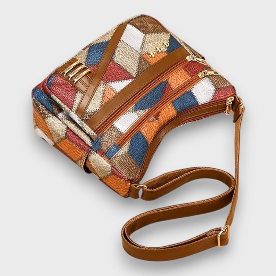 Maria patchwork shoulder bag close-up of zip compartments and gold hardware