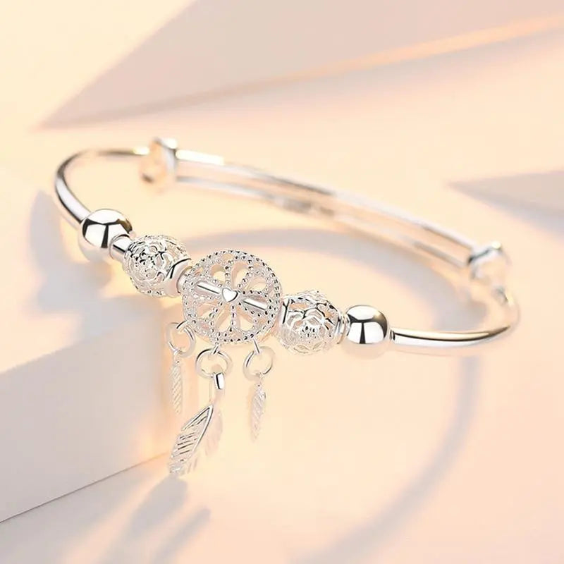 Silver dreamcatcher bangle bracelet with filigree beads, close product view