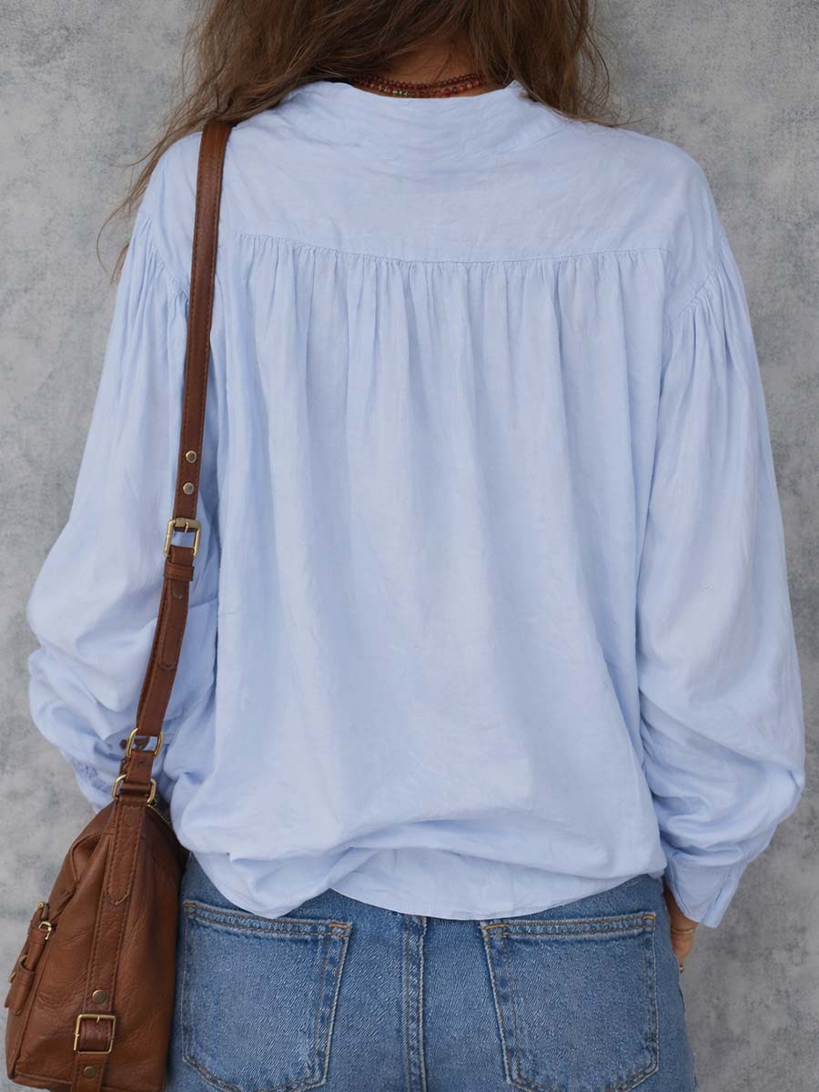 Ruffle cuffs blouse in pale blue, back view showing gathered yoke
