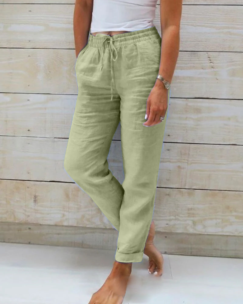 Averie relaxed drawstring trousers in green, full-length front view