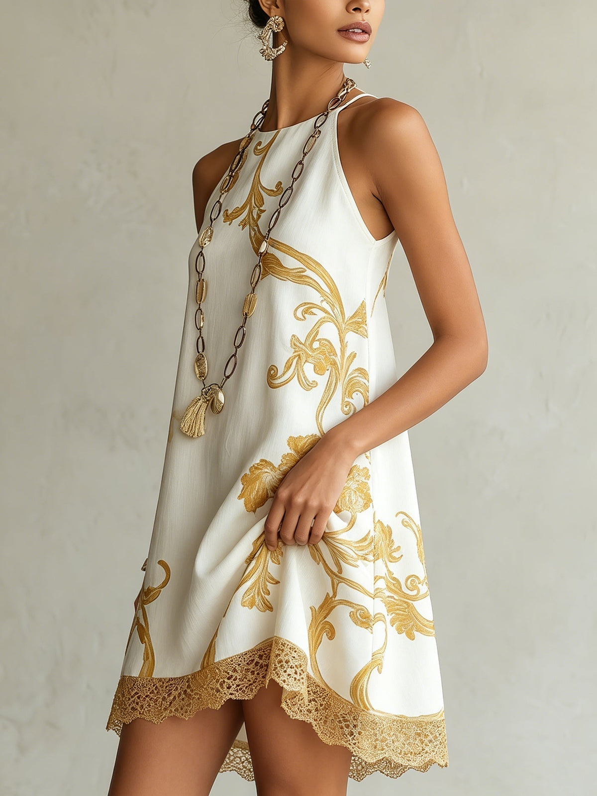Héloïse white gold-print mini dress, side view showing lace hem