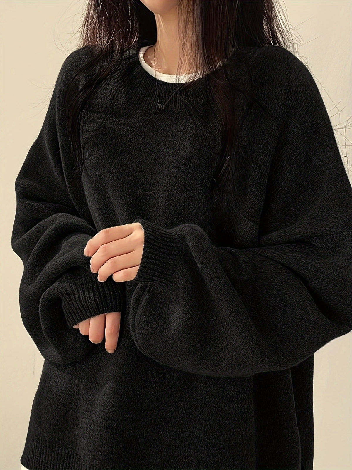 Everlight oversized sweater in black, front detail view