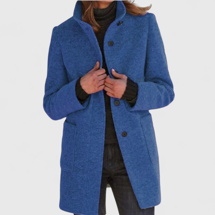 Harriette elegant coat in blue, full front view with stand-up collar