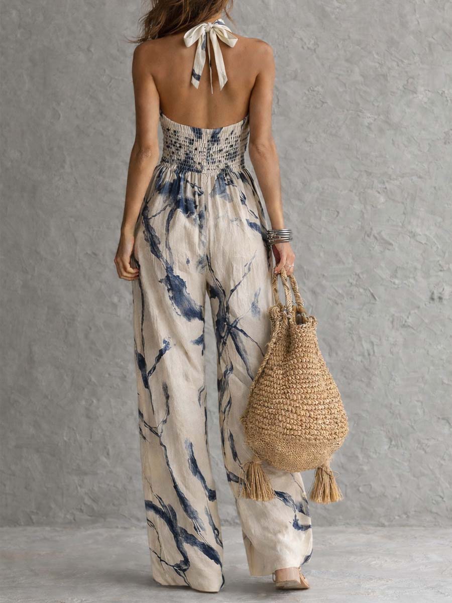 Lila jumpsuit in beige and navy, back view with halter tie and shirred panel