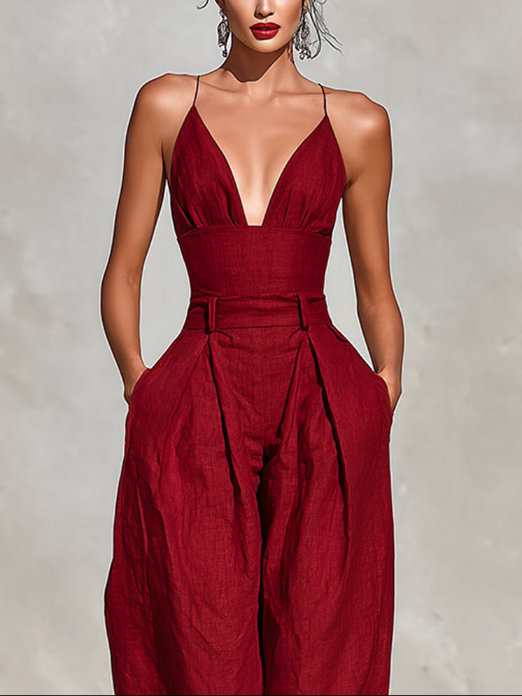 Scarlett jumpsuit in red, close-up of deep V neckline and waistband