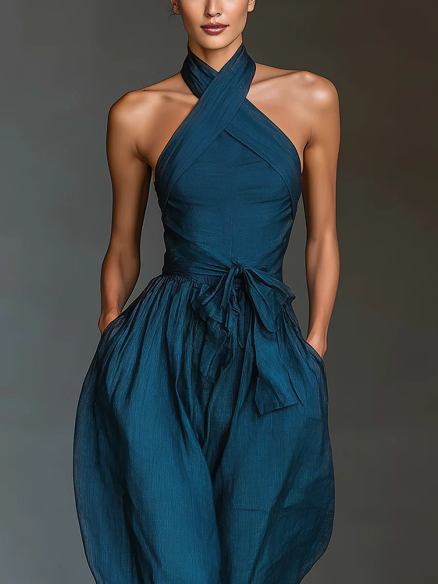 Nadia jumpsuit in navy, close-up of cross-neck halter and waist tie