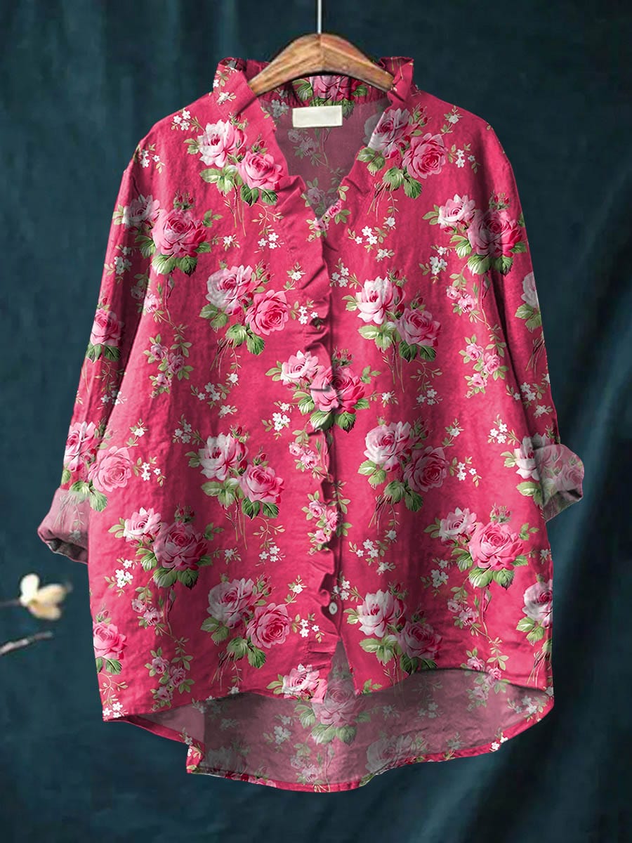 Amariel blouse in fuchsia rose print, front view on hanger