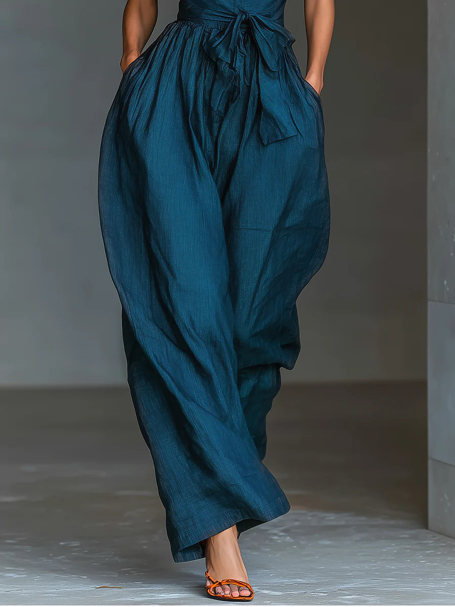 Nadia jumpsuit in navy, close-up of wide-leg trousers and side pockets