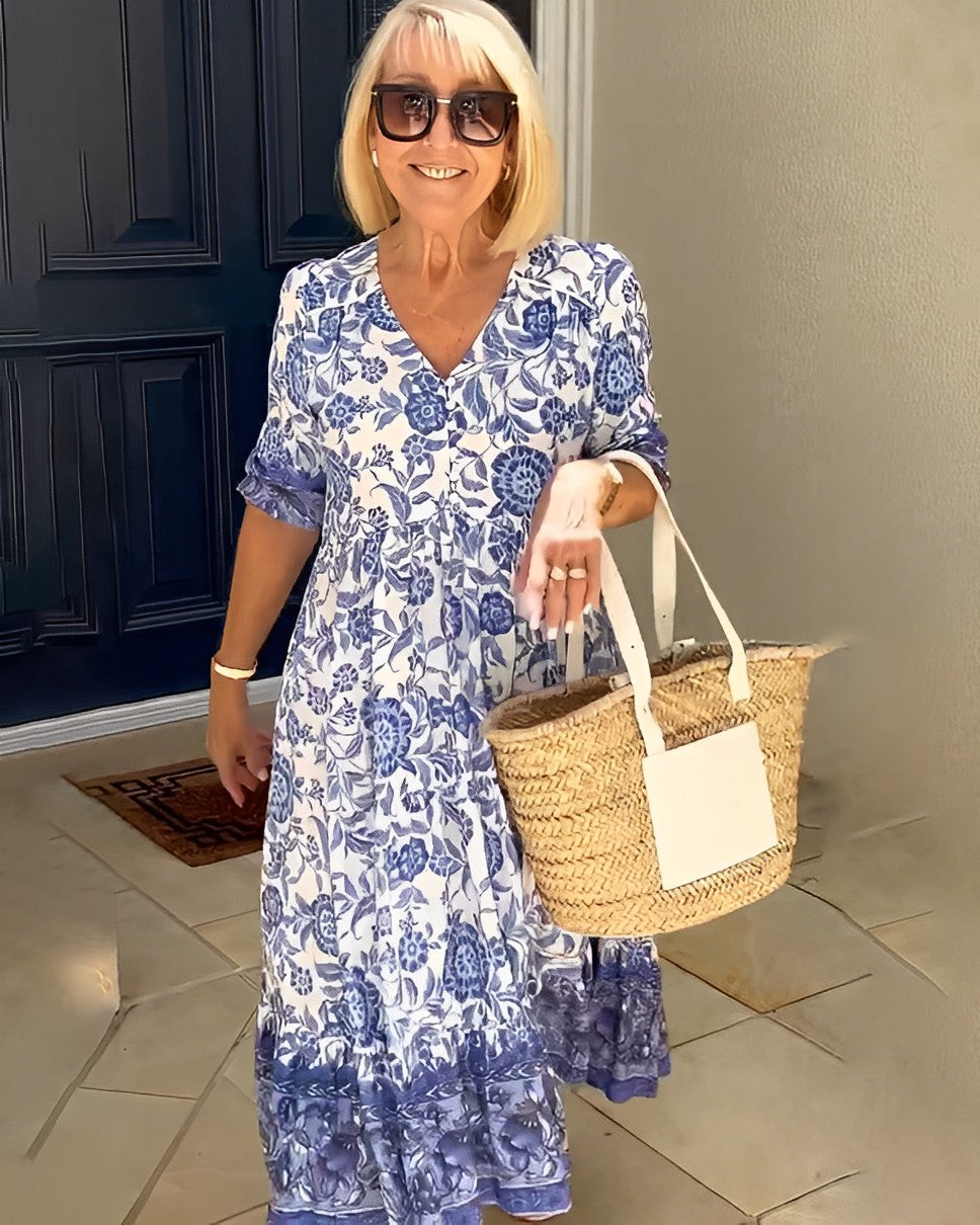 Keisha floral maxi dress in blue, three-quarter view with basket bag