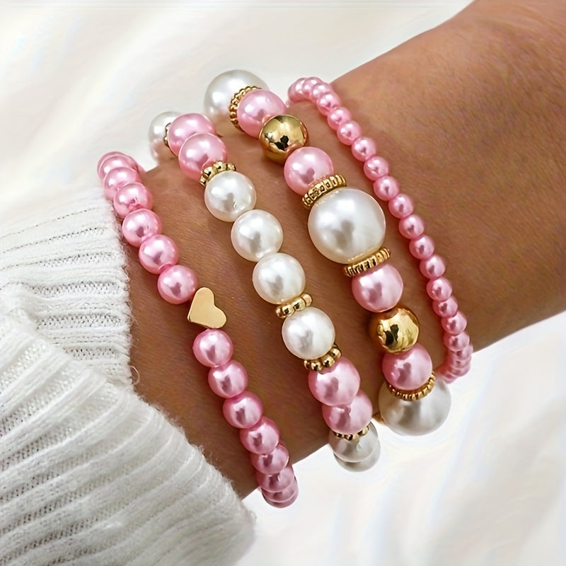 Pearl bracelet set in pink with gold beads, stacked on wrist