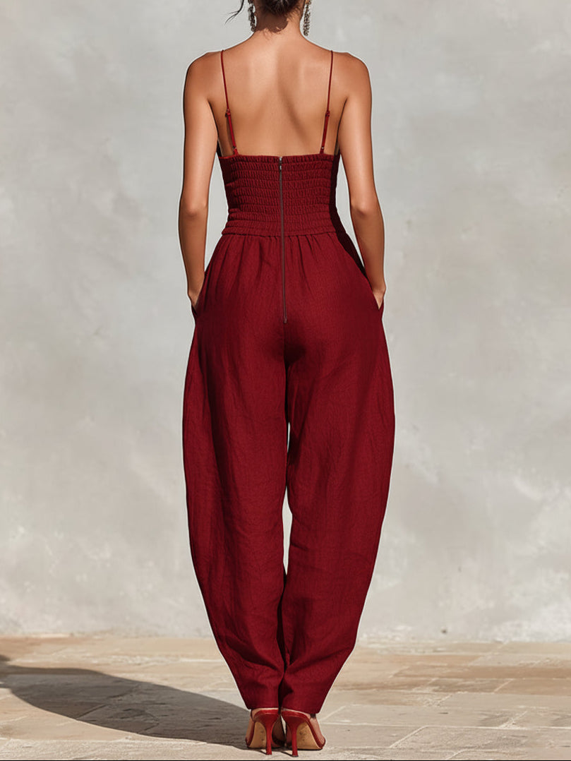 Scarlett jumpsuit in red, back view showing smocked panel and zip