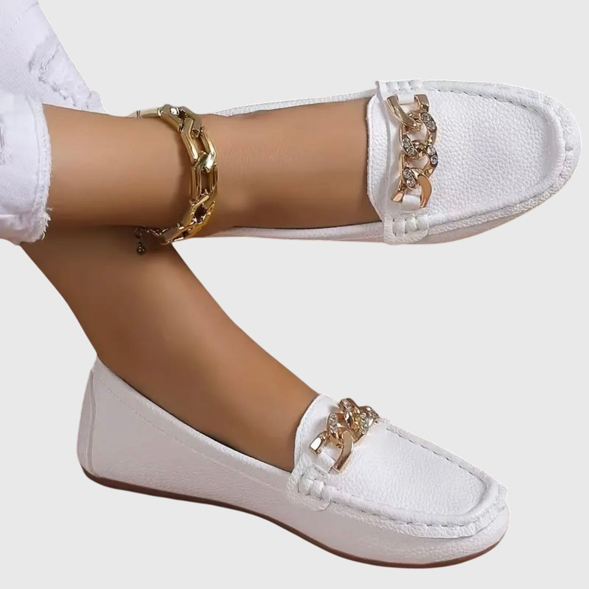 Madeleine chain-trim loafers in white, worn side view