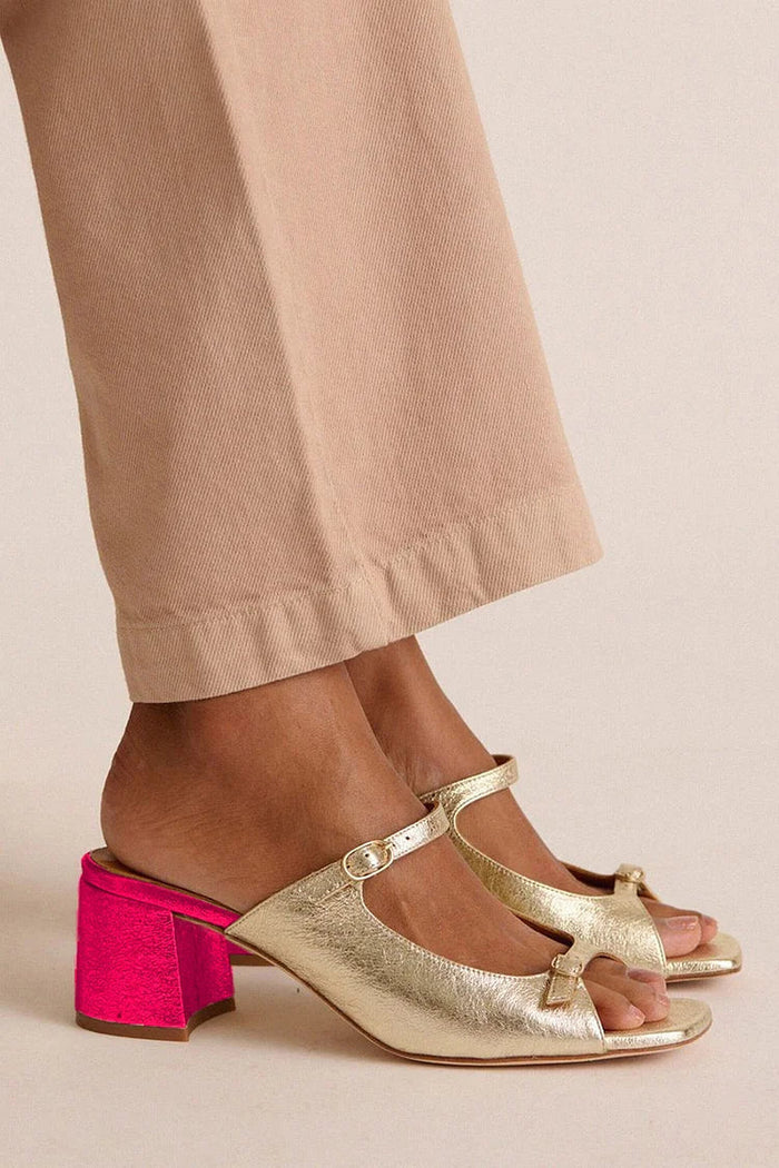 Colour-block cut-out slingback block heels in gold with pink heel, side view