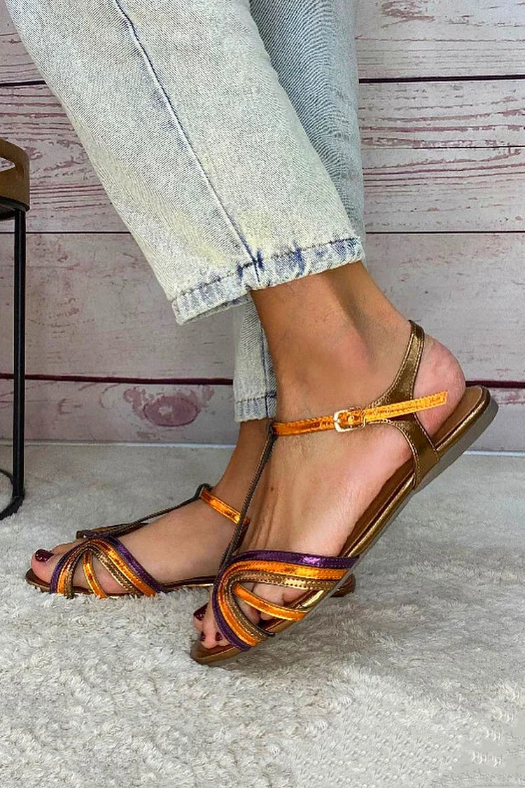 Viviana sandals in gold and orange, side view showing ankle strap and flat sole