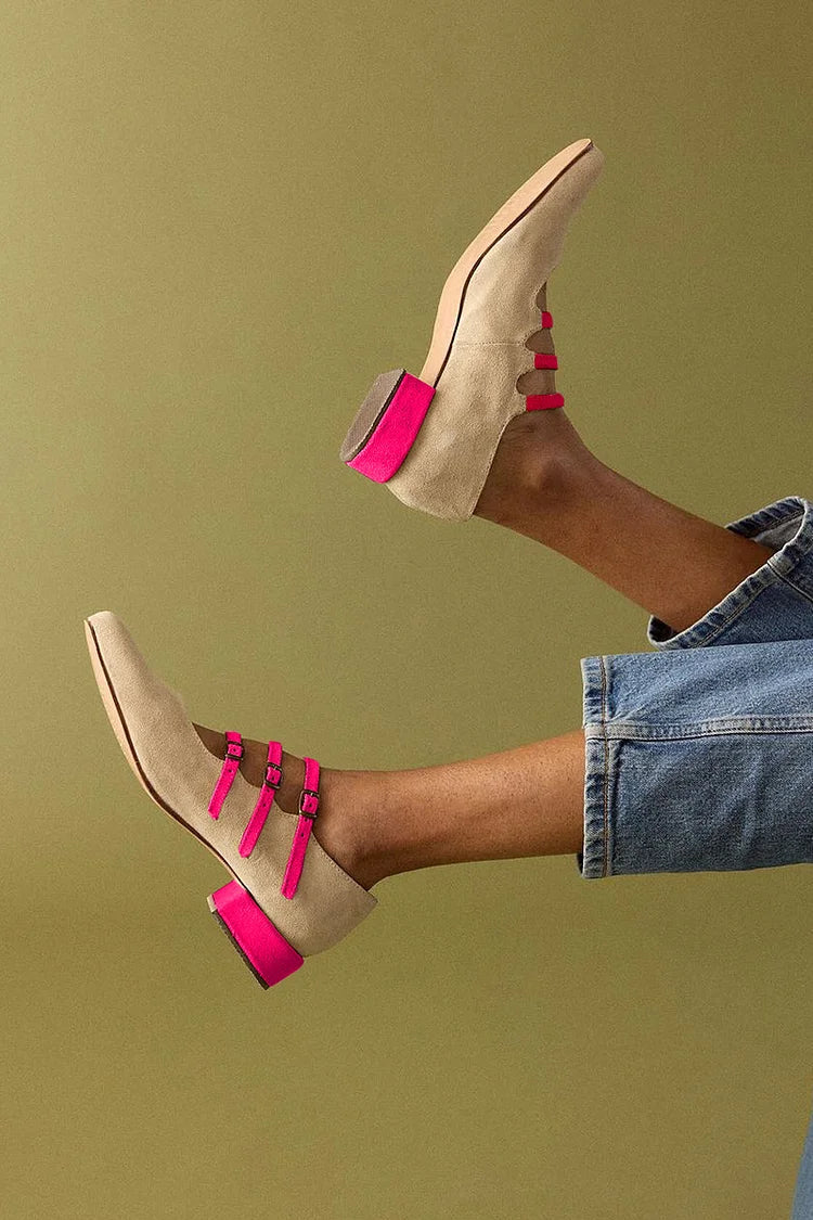 Beige colour-block low heels with pink straps and buckles, worn with jeans