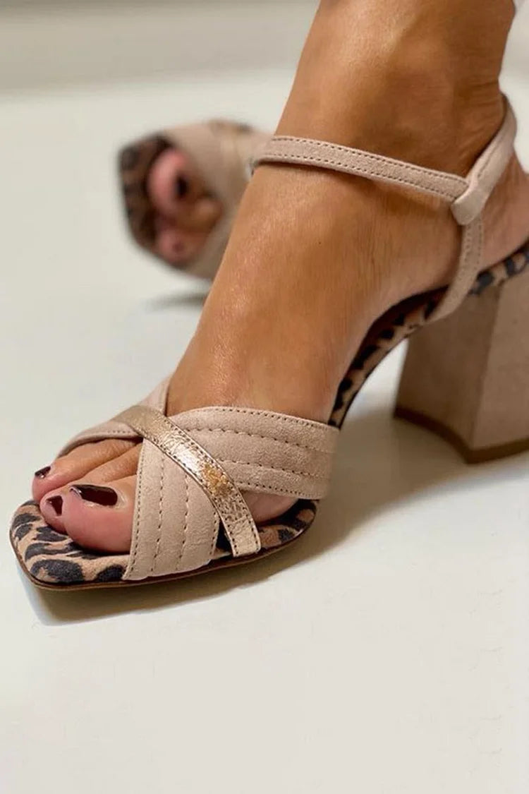Khaki leopard print peep-toe block heels, close-up of crossover straps