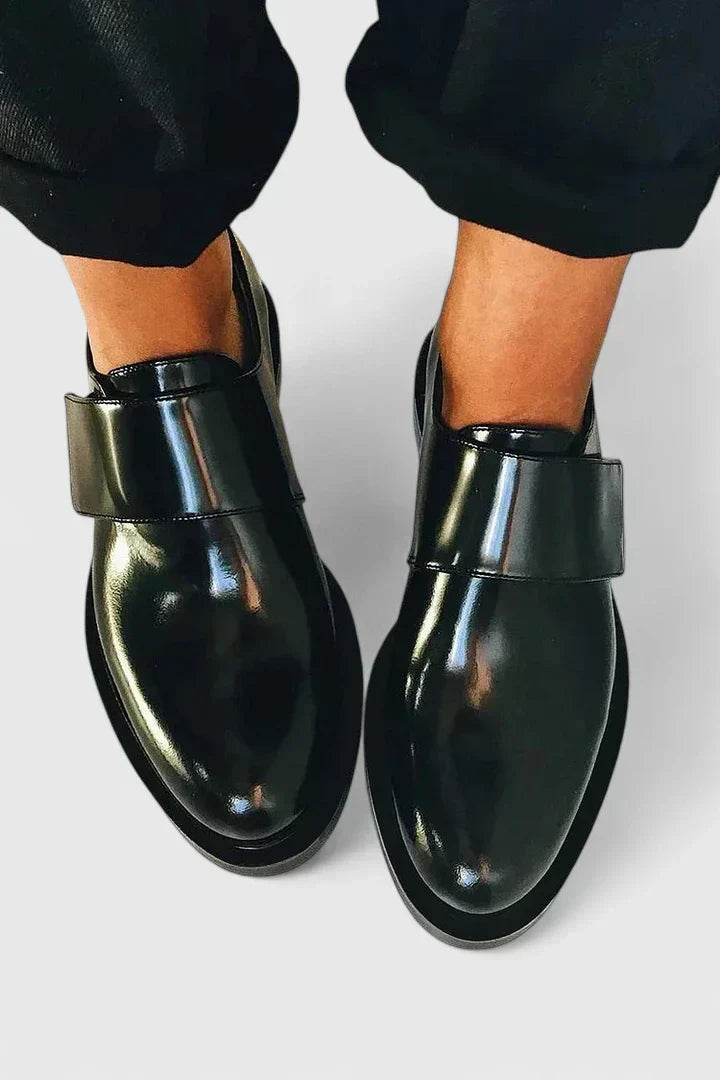 Bronwen strapped loafers in black, top-down view worn with trousers