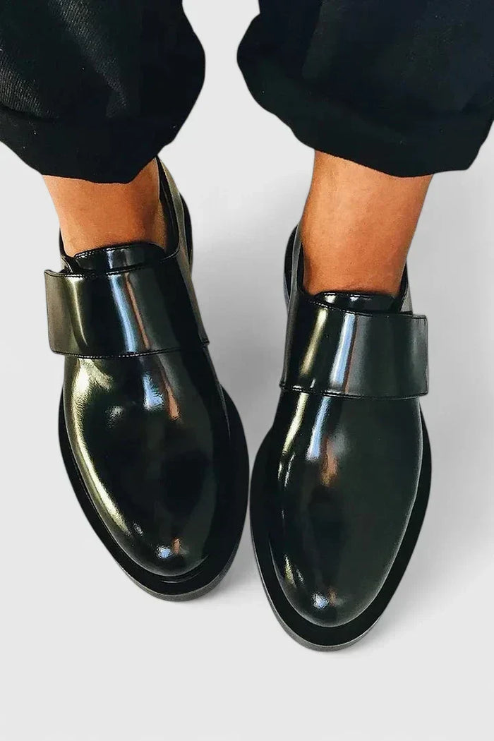 Bronwen strapped loafers in black, top-down view worn with trousers