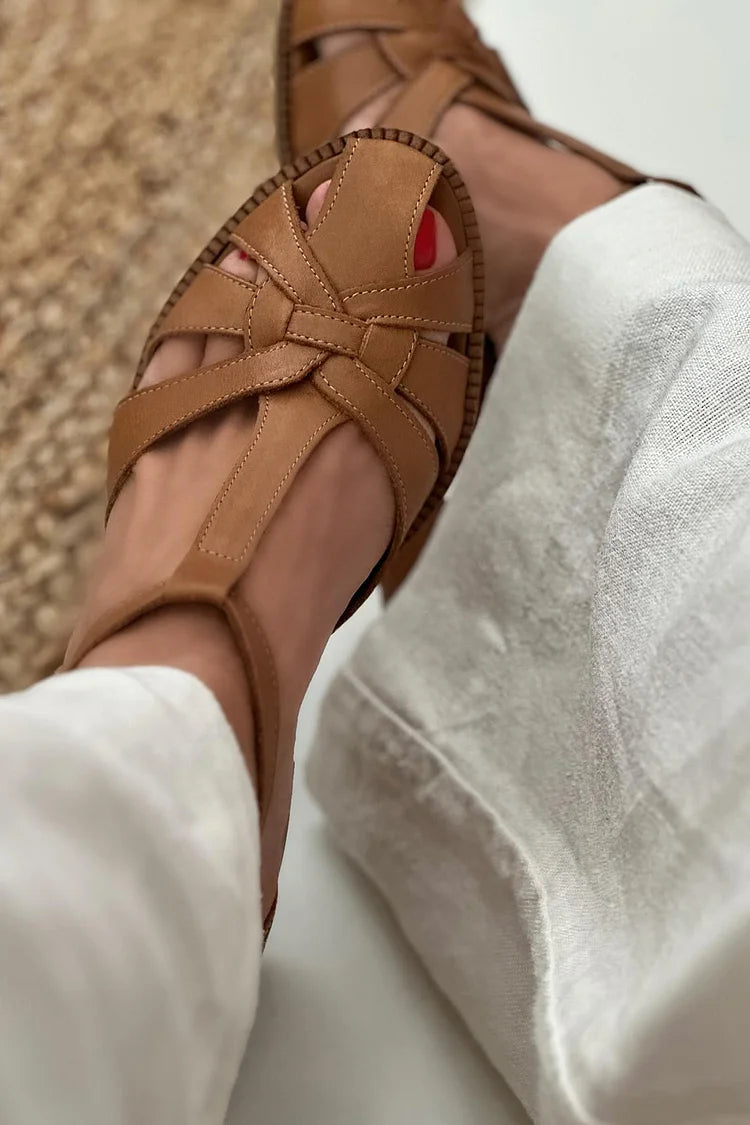 Brown woven cut-out block heels, close-up of interlaced toe straps