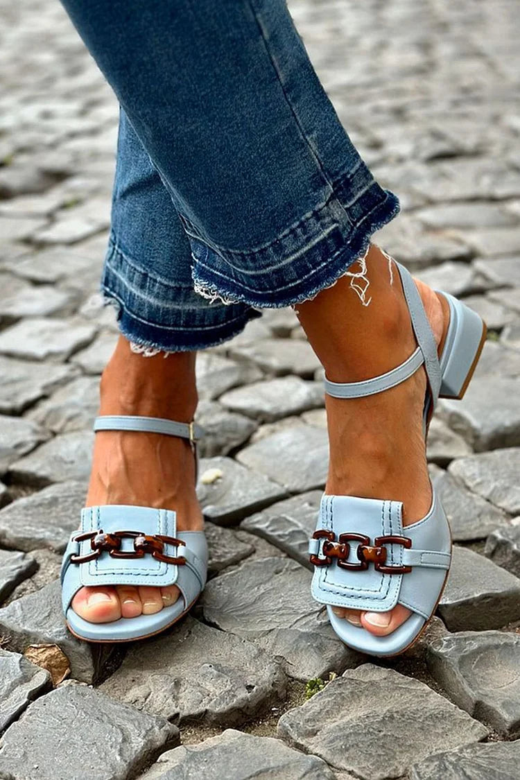 Azzurra block-heel sandals in pale blue, side view on cobbled street