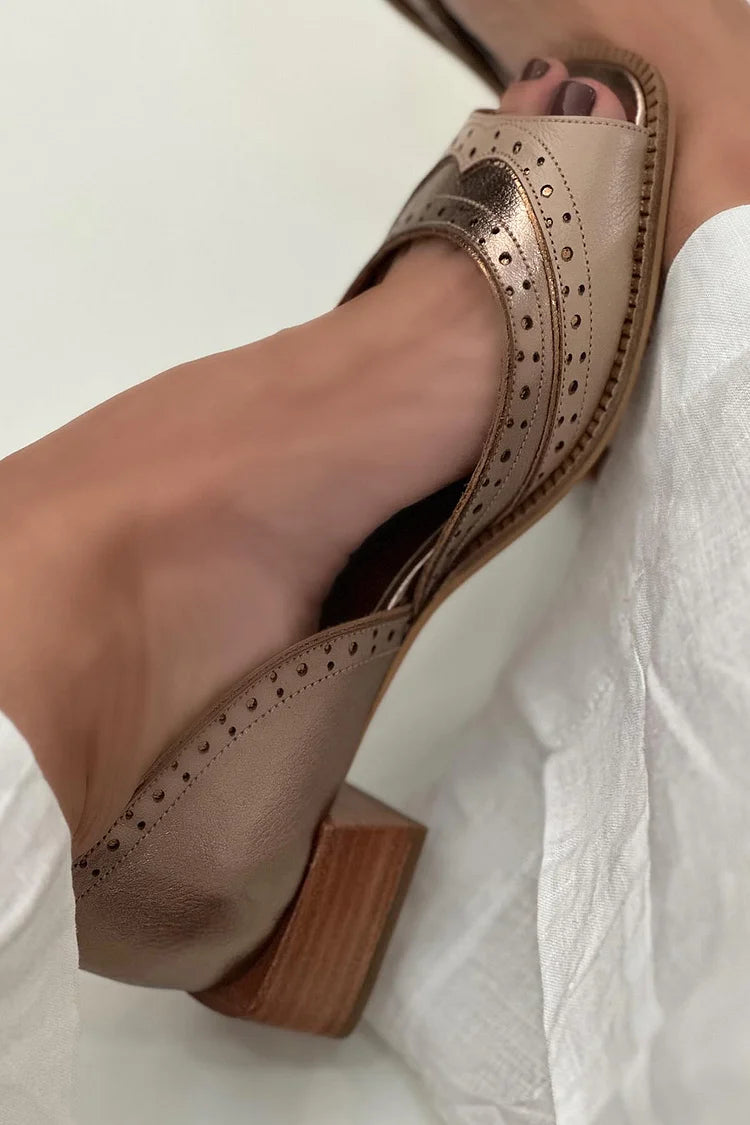 Khaki patchwork slip-on shoes with low wooden block heel, side view on model