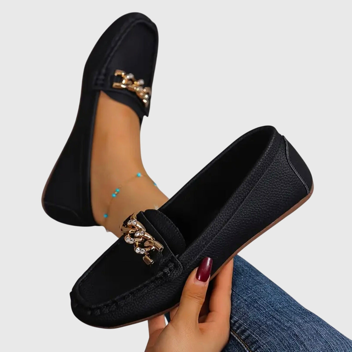 Madeleine loafers in black, close-up of chain trim and stitching